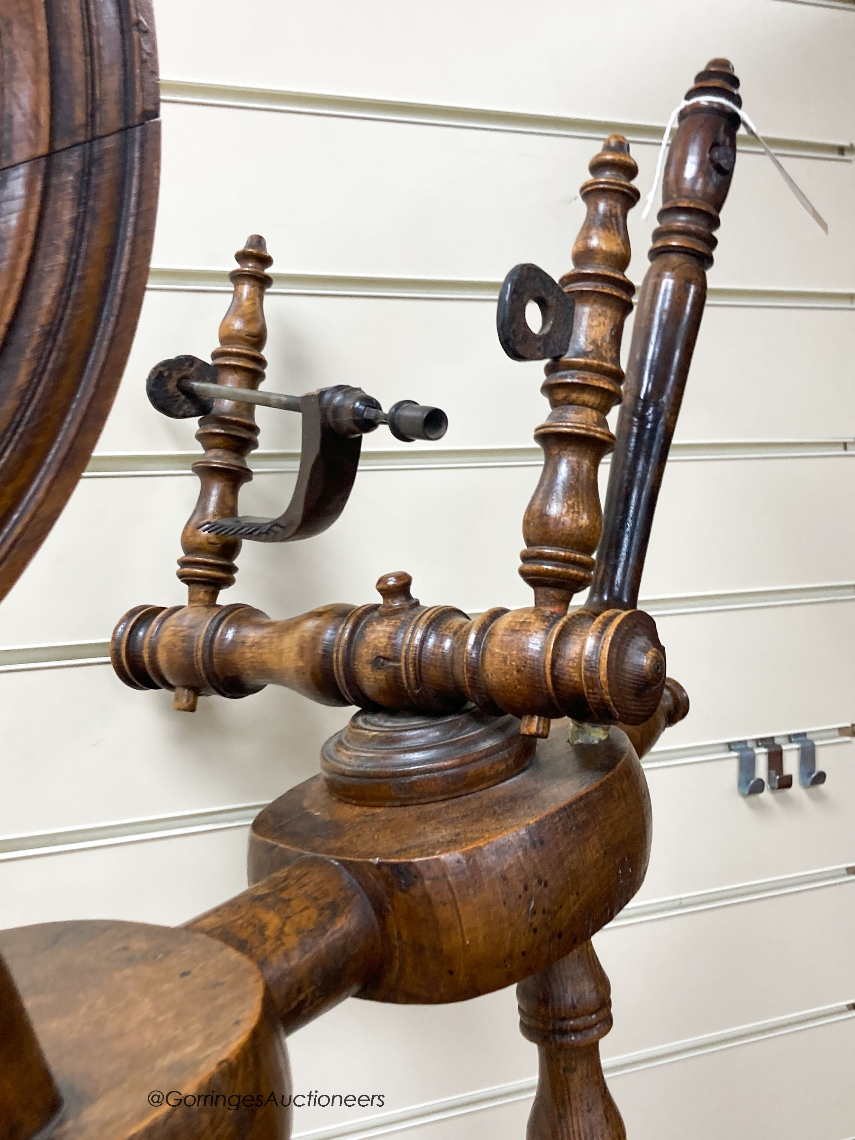 A 19th century beech and elm spinning wheel, height 92cm